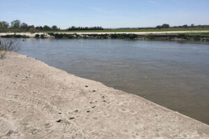 During the In the 2019 Midwest flooding, at this farm along the Loup River in Nebraska, the river channel moved into the field and will prevent the pivot in the background from making a full circle.